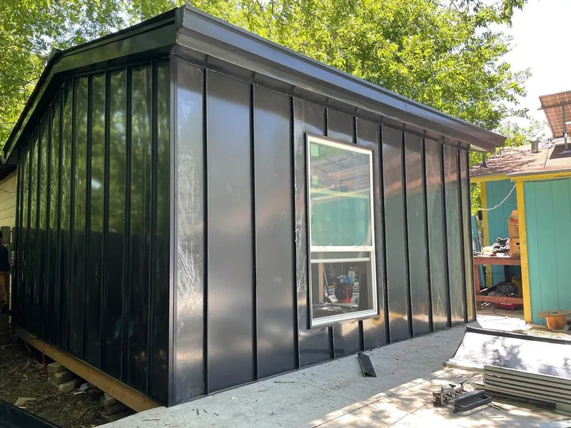 Black standing seam metal wall panels for Roof Inspection in East Bay