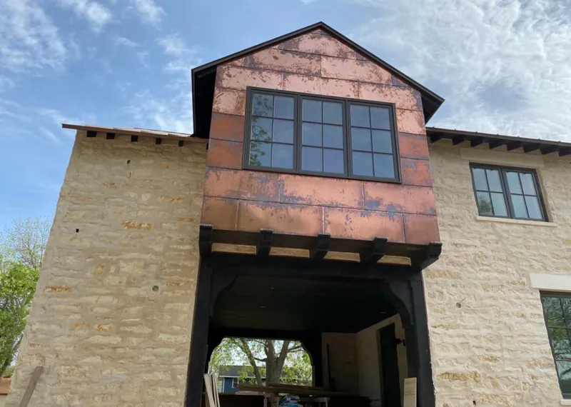 Copper metal panel facade on a stone building for Metal Roof Coating in East Bay